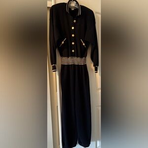 Vintage black pure wool jumpsuit with gold detail on collar, waist and sleeves.